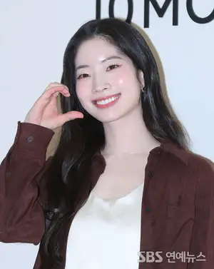 TWICE's DAHYUN Flashes a Radiant Smile with a Heart Pose